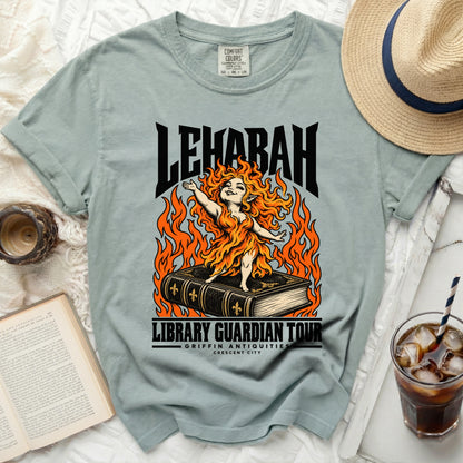 Light blue t-shirt with LEHABAH LIBRARY GUARDIAN TOUR Griffin Antiquities graphic.