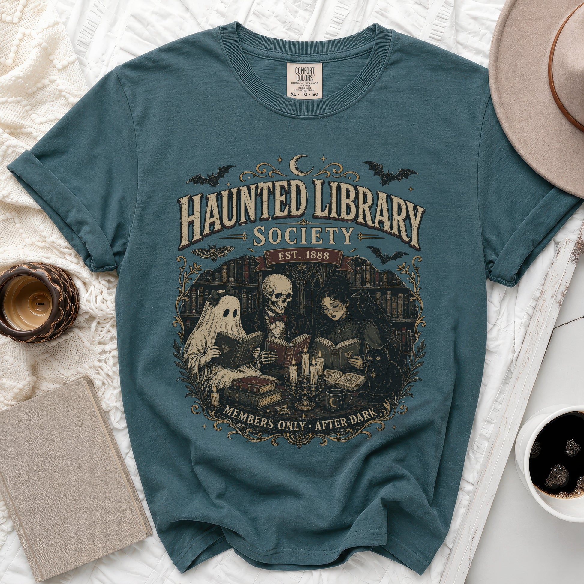 Teal t-shirt with "Haunted Library Society Est. 1888 Members Only After Dark" graphic.