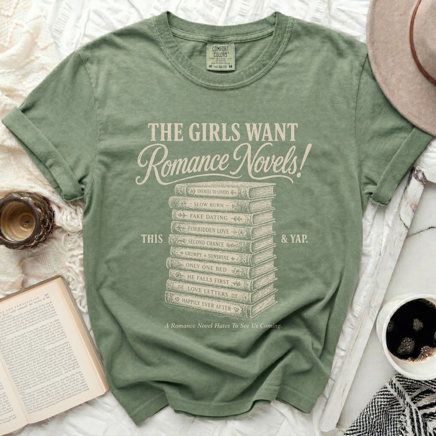 Green t-shirt with "The Girls Want Romance Novels!" and book genre titles.