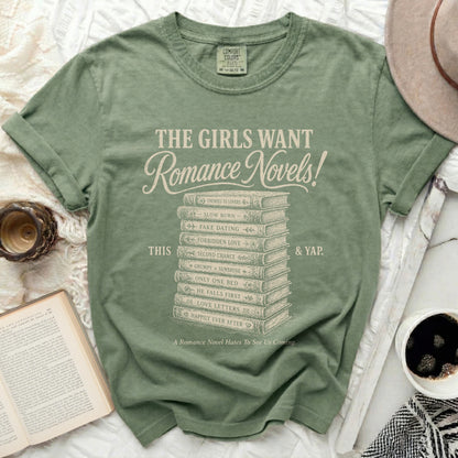 Green t-shirt with "The Girls Want Romance Novels!" and book genre titles.