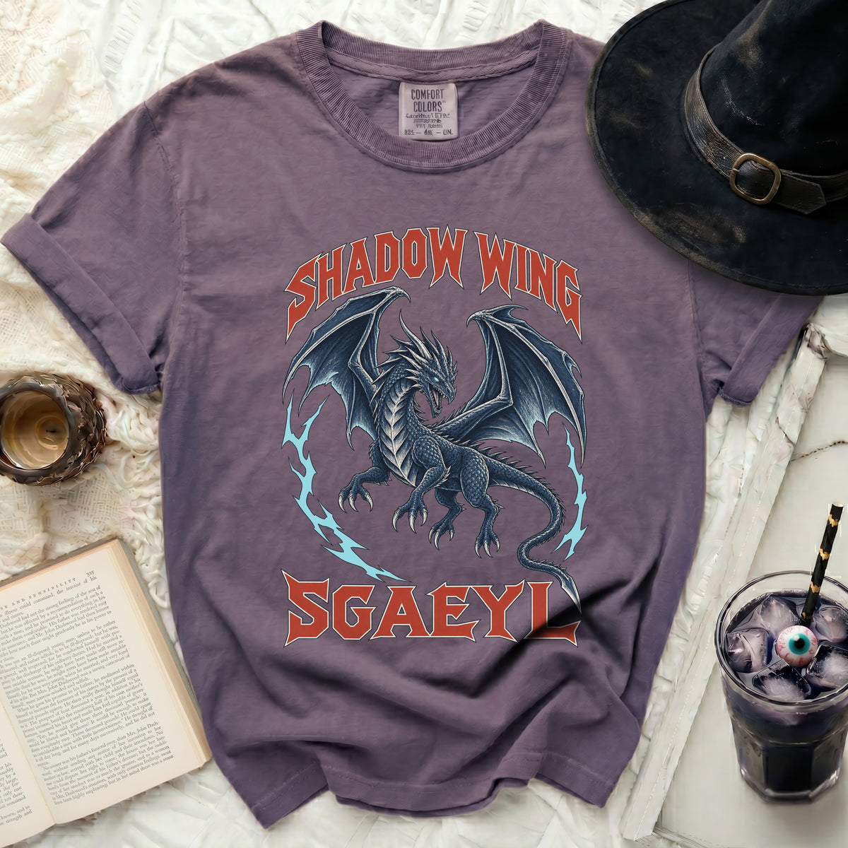 Purple t-shirt with a black dragon and text "SHADOW WING SGAEYL".