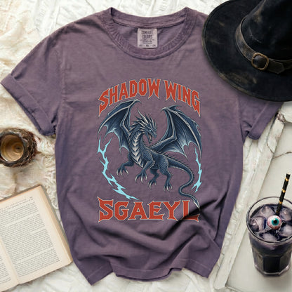 Purple t-shirt with a black dragon and text "SHADOW WING SGAEYL".