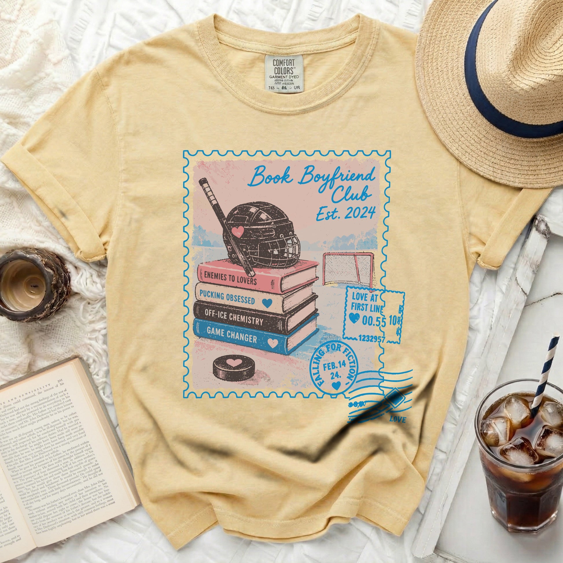 Yellow t-shirt with "Book Boyfriend Club" ice hockey graphic and text.