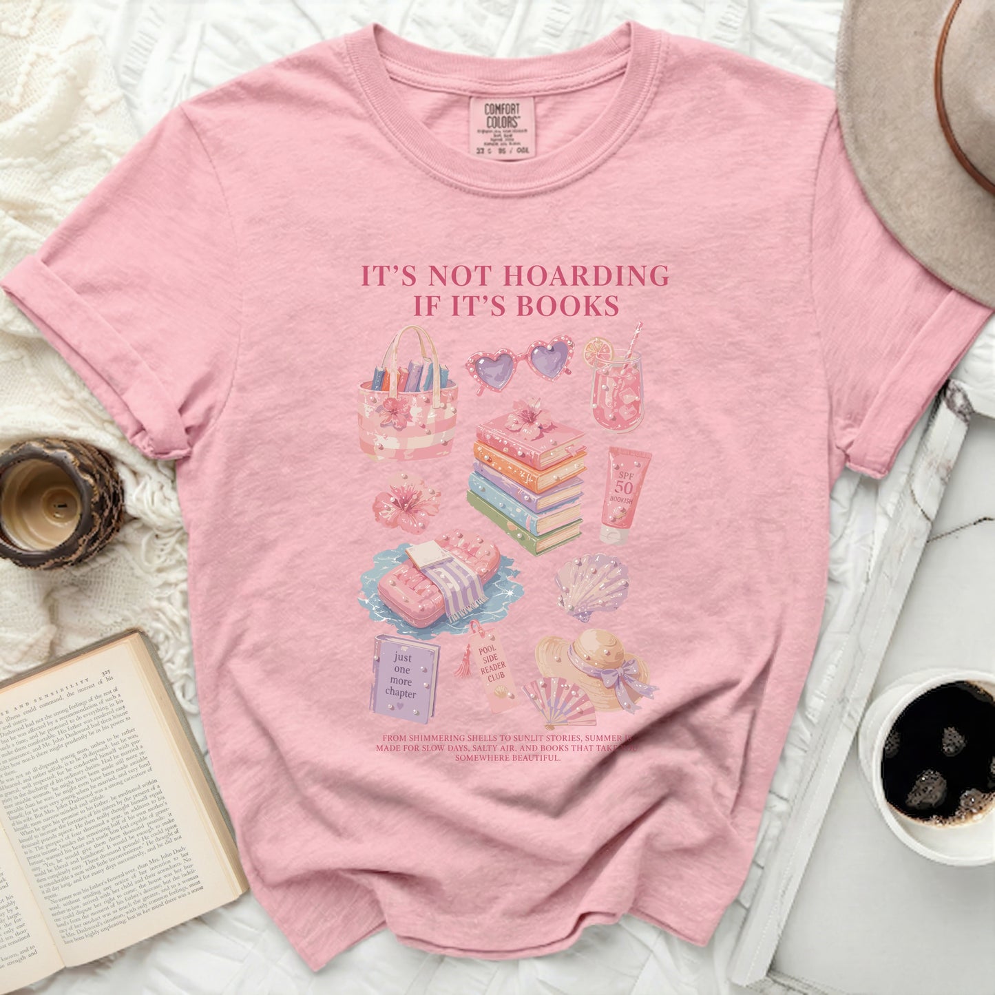 Pink t-shirt with "It's Not Hoarding If It's Books" and bookish summer graphics.
