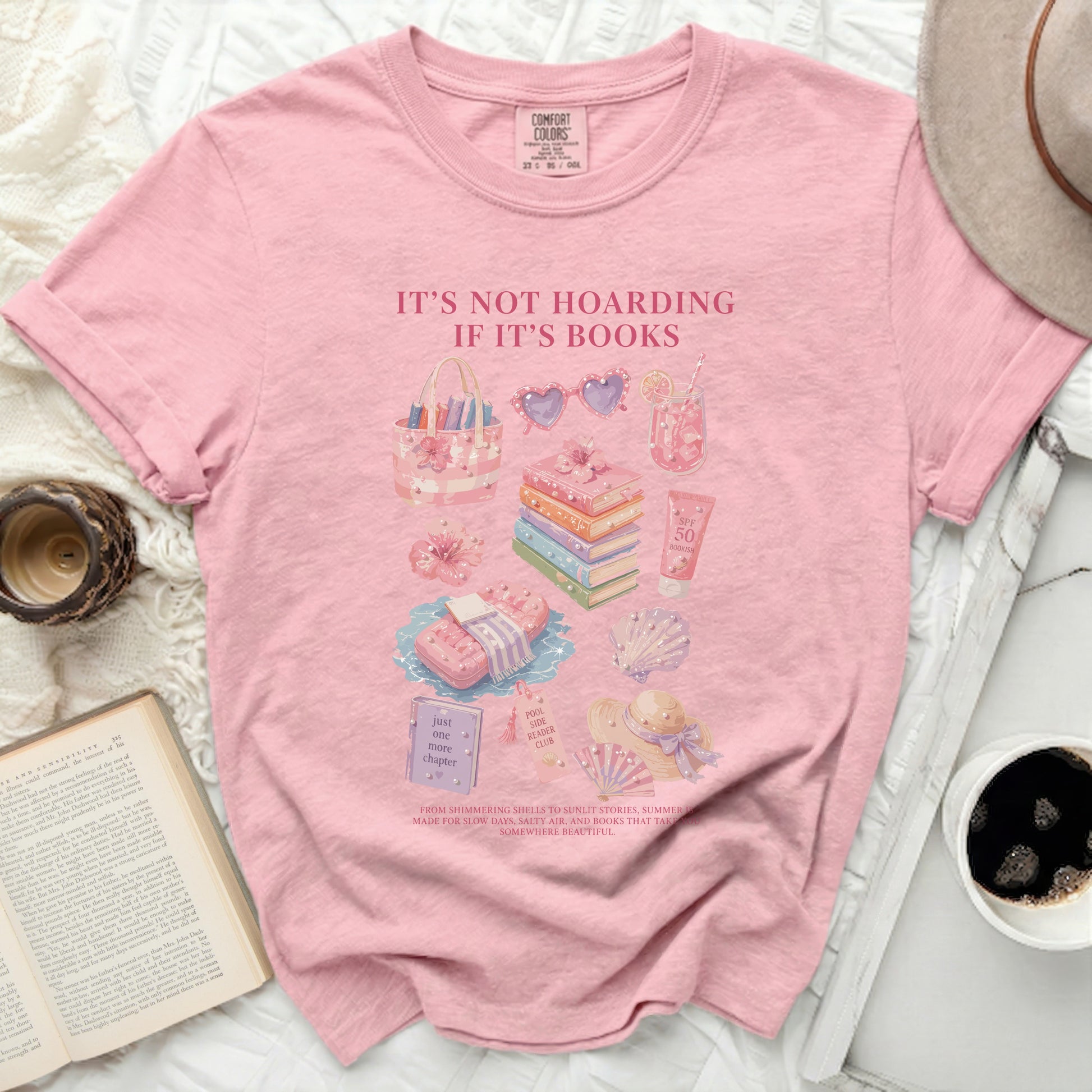 Pink t-shirt with "It's Not Hoarding If It's Books" and bookish summer graphics.