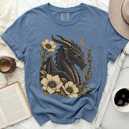 Blue t-shirt with a dark dragon and flowers graphic design, comfort colors tag.