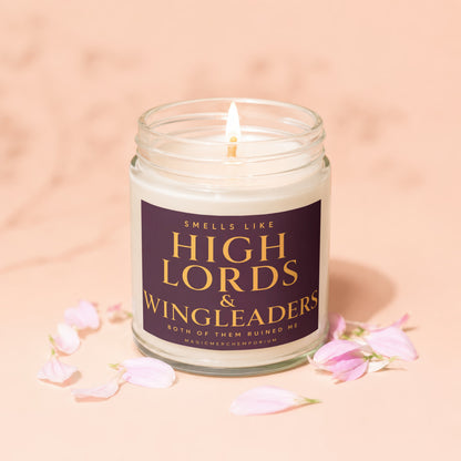 Jar candle, lit wick, with text "Smells like High Lords & Wingleaders".