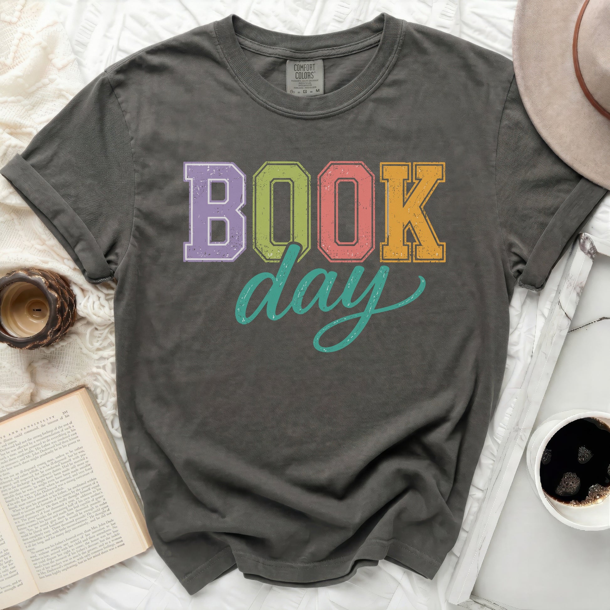 Dark gray t-shirt with "BOOK day" graphic in colorful block letters.