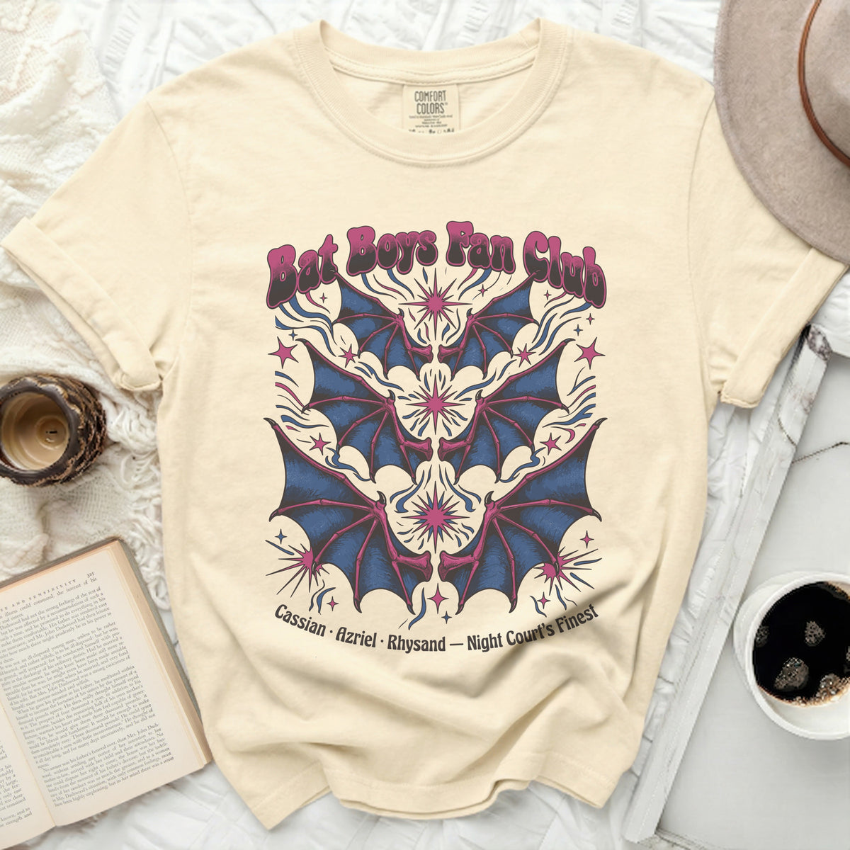 Cream t-shirt with "Bat Boys Fan Club" text and bat wing graphic.