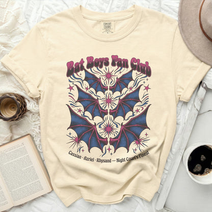 Cream t-shirt with "Bat Boys Fan Club" text and bat wing graphic.