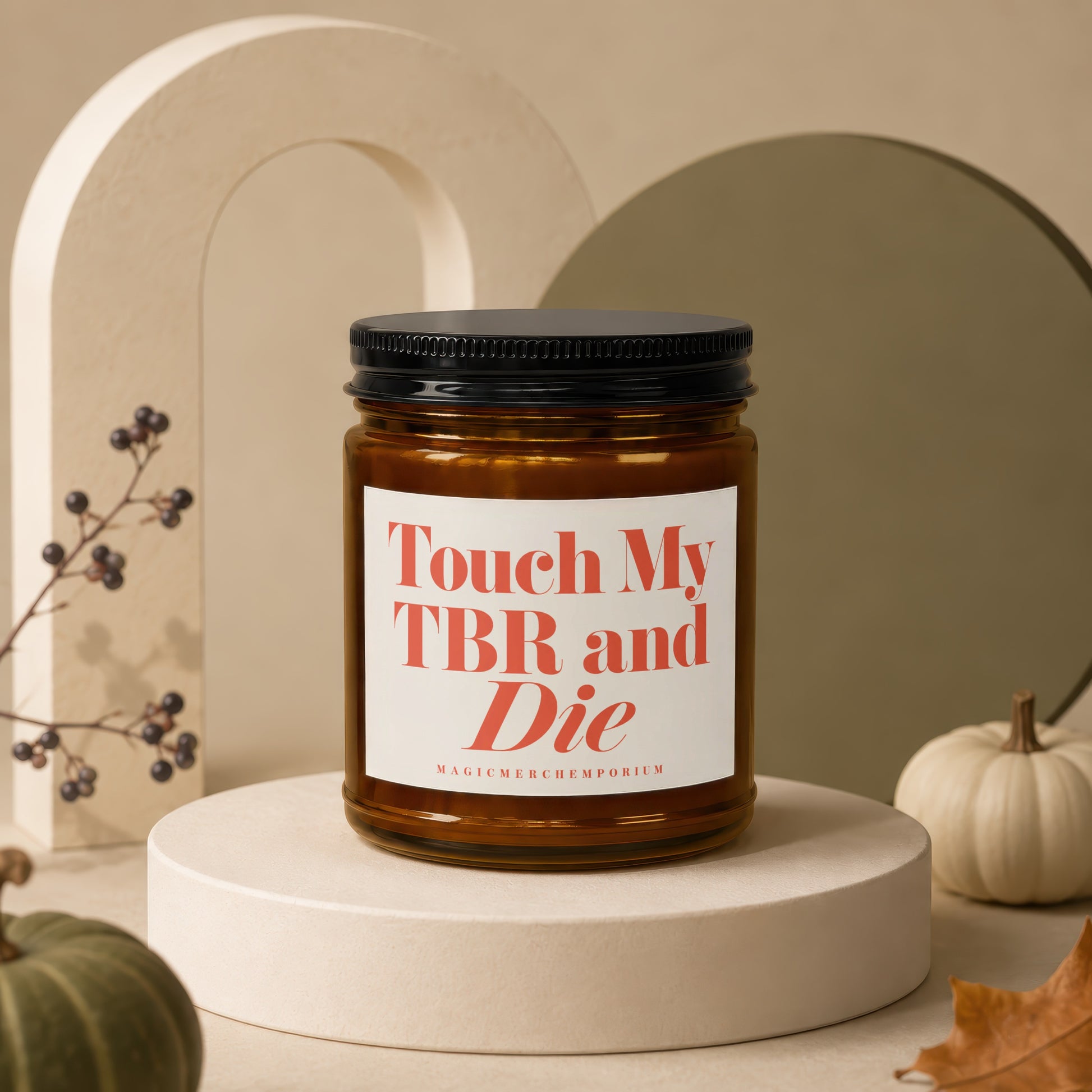Amber glass candle with black lid, label reads "Touch My TBR and Die"