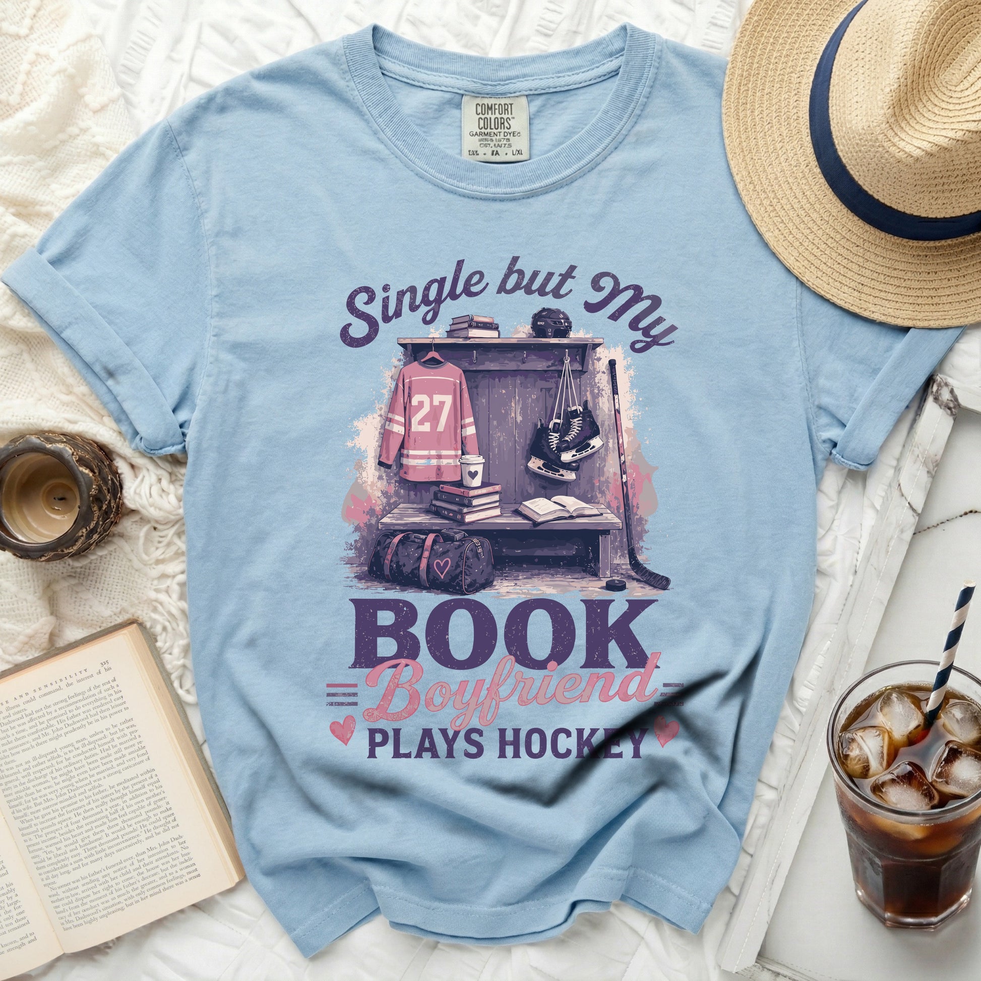 Light blue t-shirt with "Single but My Book Boyfriend Plays Hockey" graphic.