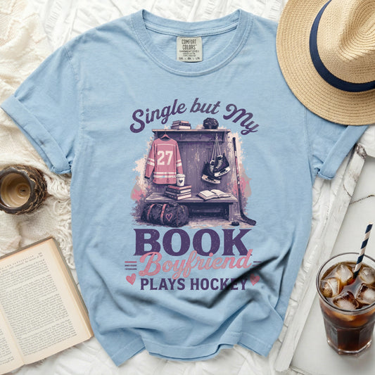 Light blue t-shirt with "Single but My Book Boyfriend Plays Hockey" graphic.