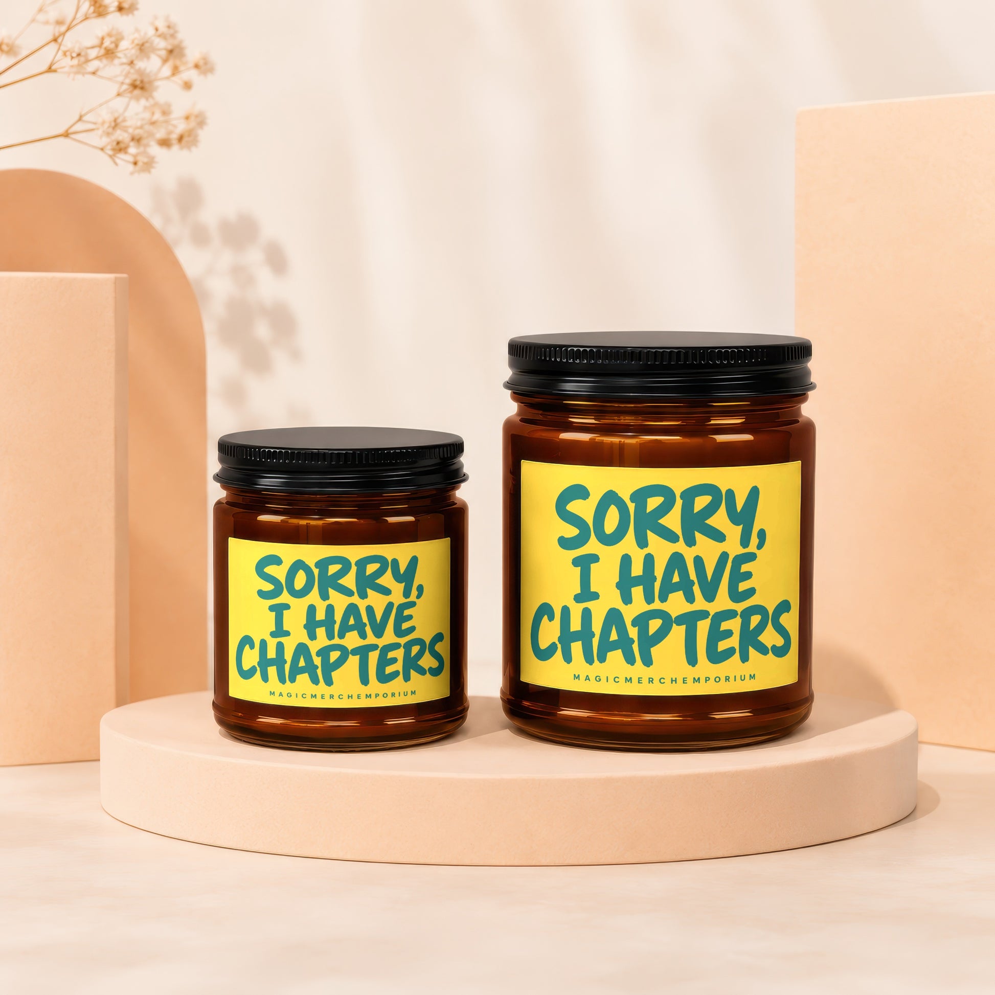 Two amber glass jars with black lids, labels read "Sorry, I Have Chapters".