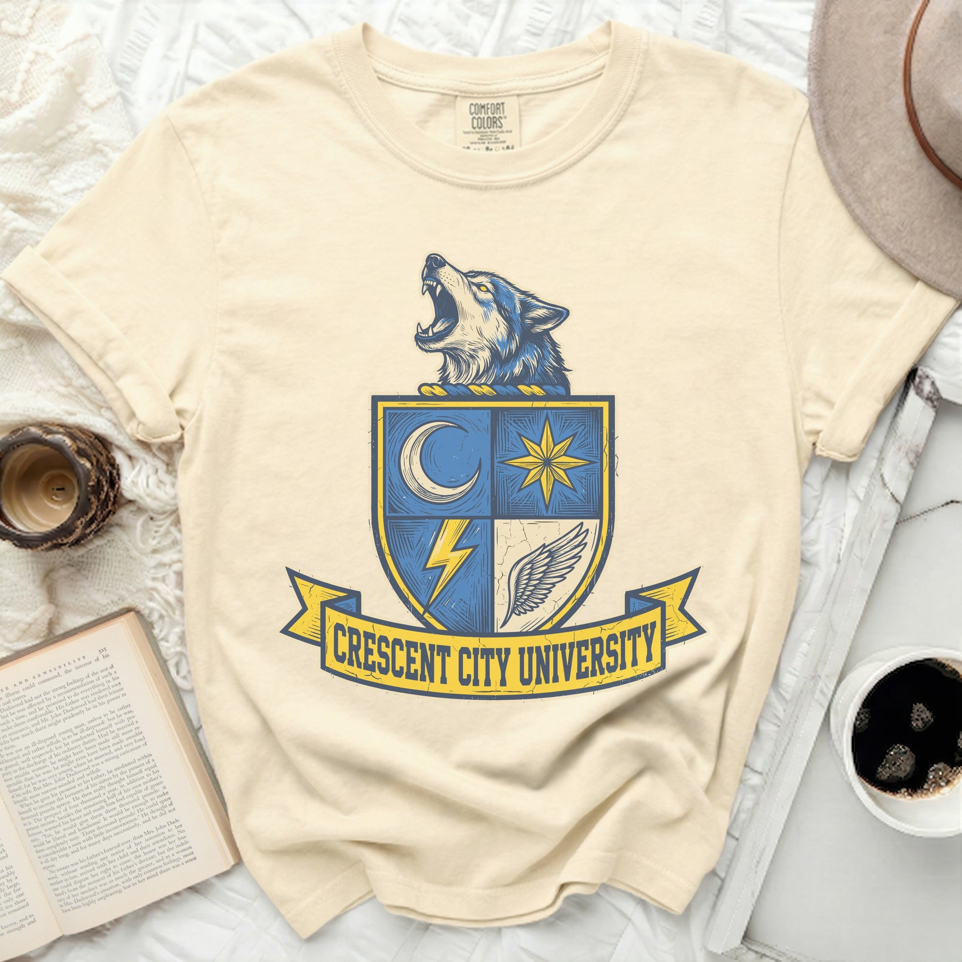 Cream t-shirt with Crescent City University crest featuring a wolf and lightning bolt.