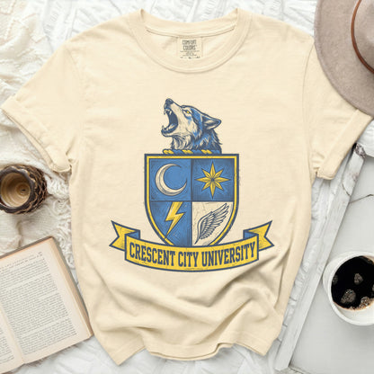 Cream t-shirt with Crescent City University crest featuring a wolf and lightning bolt.