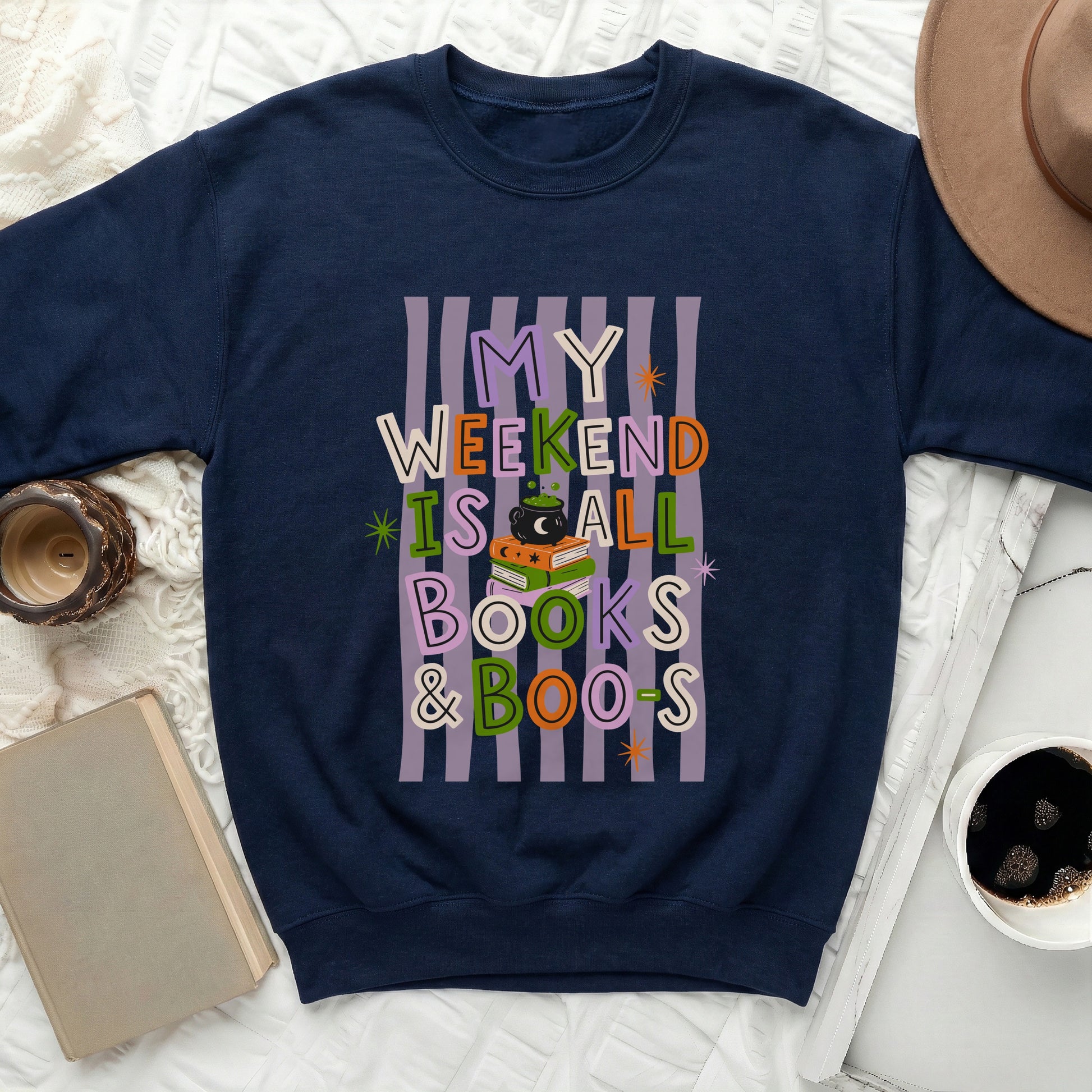 Navy sweatshirt with text "My Weekend Is All Books & Boos" and Halloween graphics.
