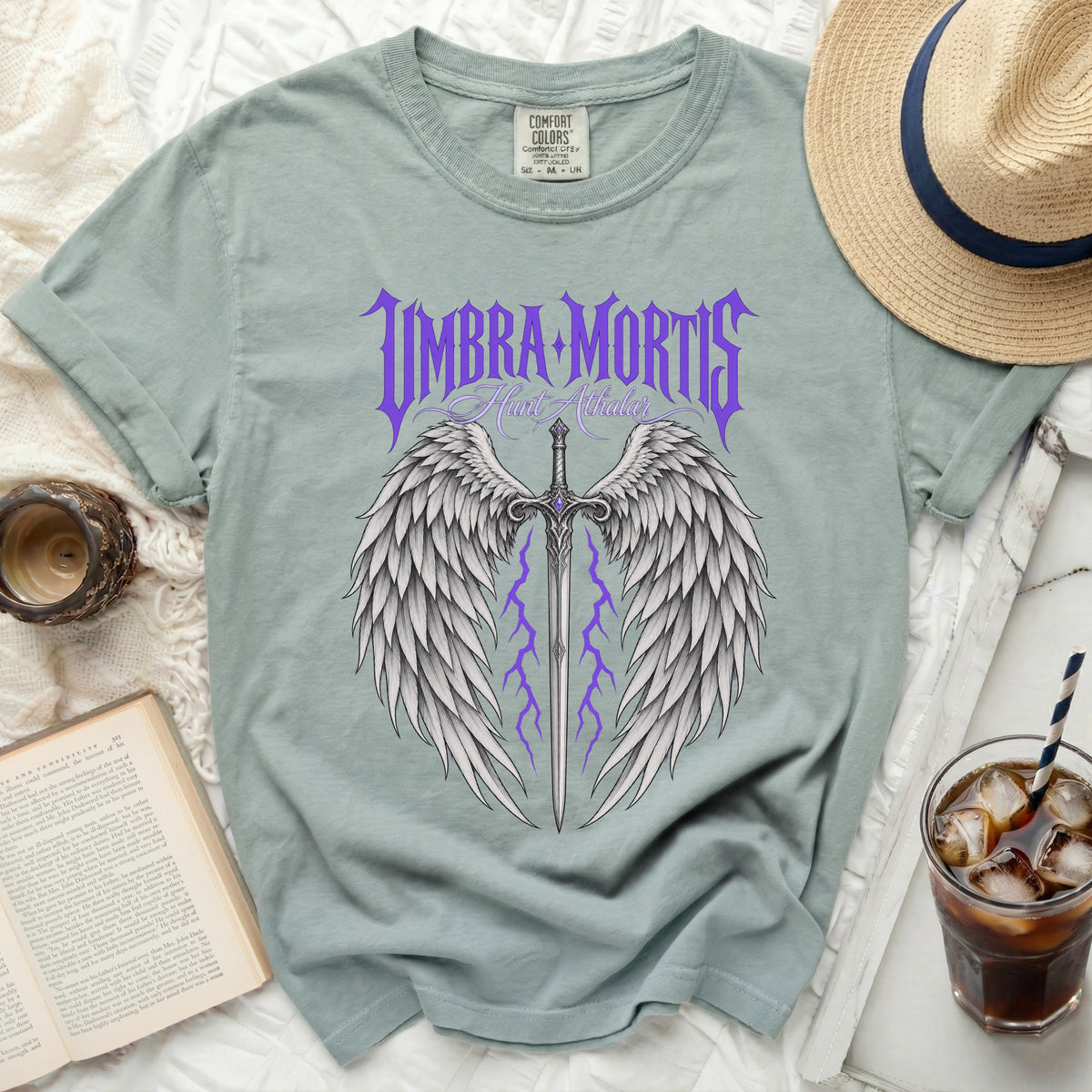Green t-shirt with "Umbra Mortis Hunt Athalar" and winged sword design.