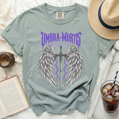 Green t-shirt with "Umbra Mortis Hunt Athalar" and winged sword design.
