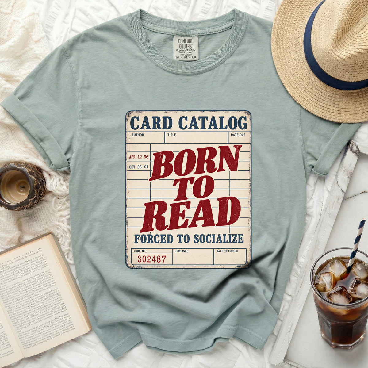 Comfort Colors t-shirt with "Born to Read Forced to Socialize" card catalog design.