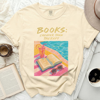 Cream t-shirt with "BOOKS: CHEAPER THAN THERAPY" text.