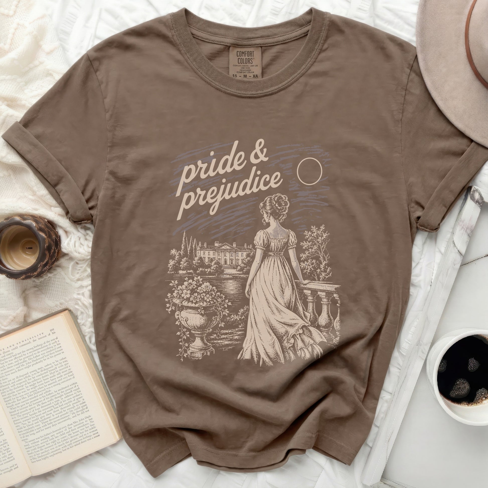 Brown shirt with "Pride & Prejudice" literary scene graphic.