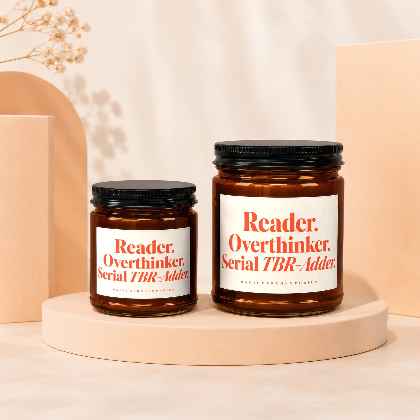 Two amber glass jars with black lids, each labeled "Reader. Overthinker. Serial TBR-Adder."