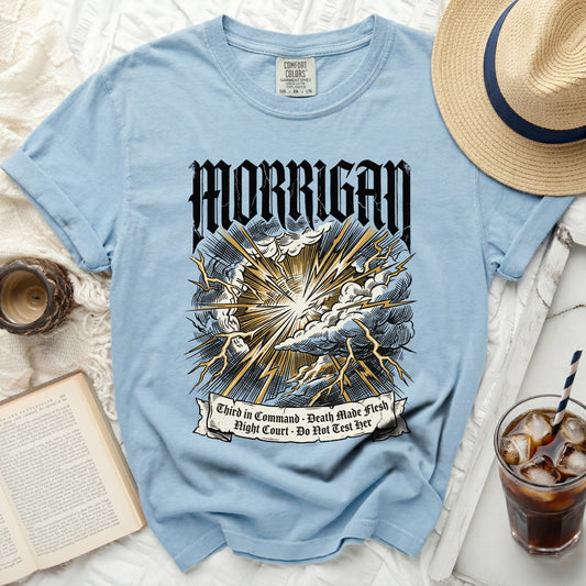Light blue t-shirt with black and gold lightning graphic and text.