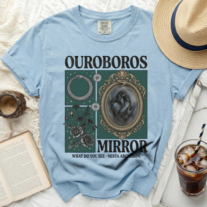Light blue t-shirt with OUROBOROS MIRROR graphic and text.