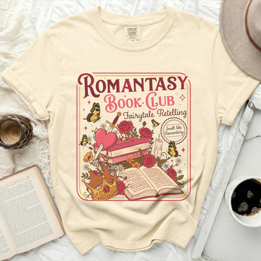 Cream t-shirt with "Romantasy Book Club" graphic featuring books, crown, and butterflies.