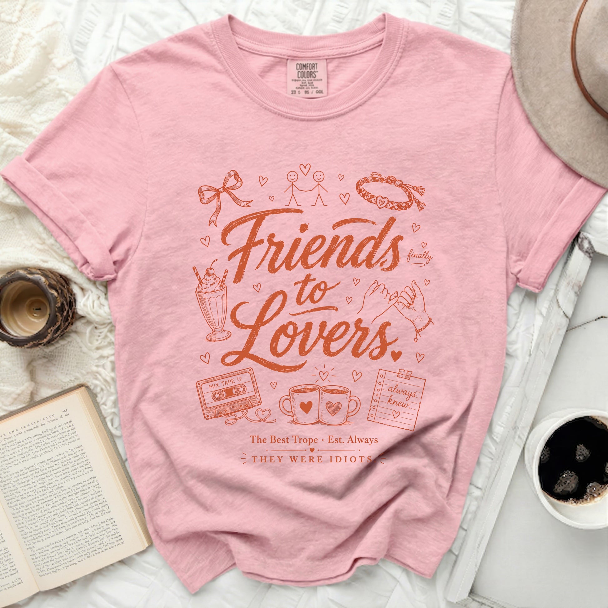 Pink t-shirt with "Friends to Lovers" graphic and mixtape design.