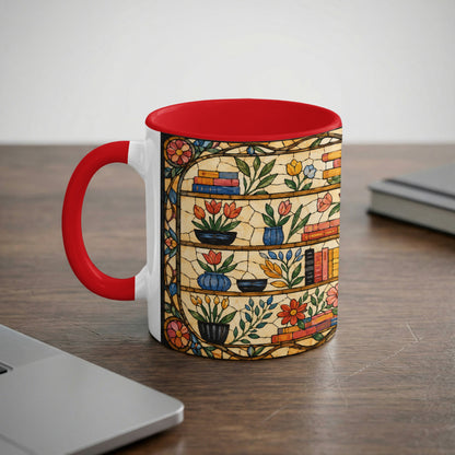 Mug with red handle and interior featuring a stained glass bookshelf design.