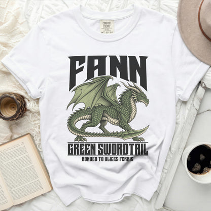 White t-shirt with a green dragon graphic and text "FANN", "GREEN SWORDTAIL", "BONDED TO ULICES FERRIS".