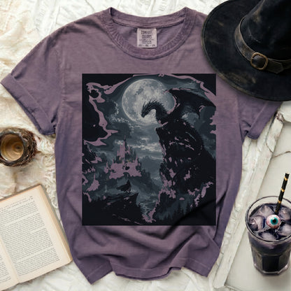 Purple t-shirt with a printed image of a dragon overlooking a castle.