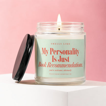 Glass candle with lit wick and text "My Personality Is Just Book Recommendations".