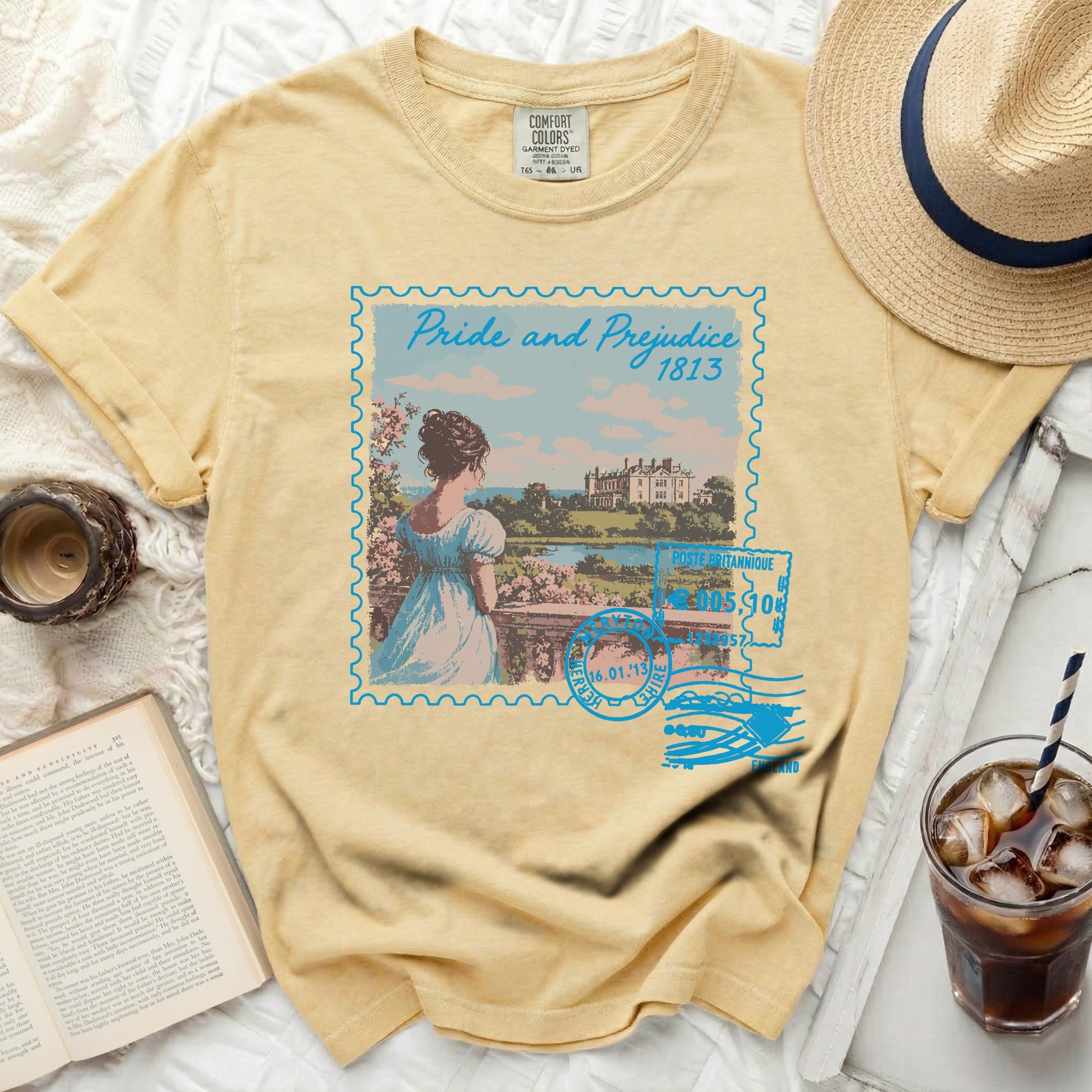 Yellow t-shirt with "Pride and Prejudice 1813" stamp graphic.