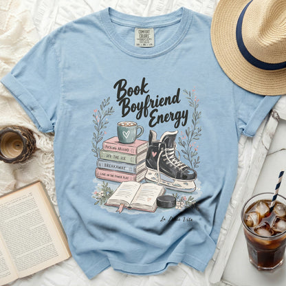 Light blue t-shirt with "Book Boyfriend Energy" text and hockey graphics.