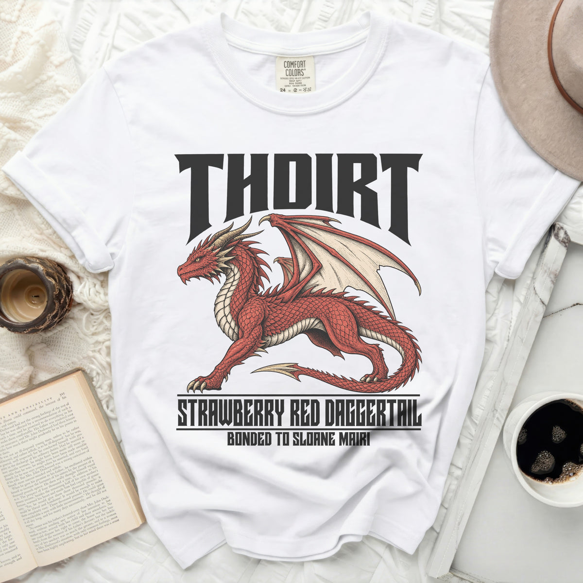 White t-shirt with a red dragon graphic and text "THOIRT STRAWBERRY RED DAGGERTAIL".