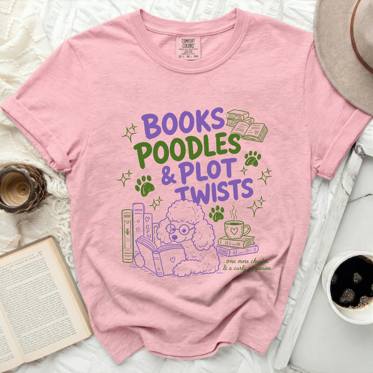 Pink t-shirt with "Books Poodles & Plot Twists" text and poodle graphic.