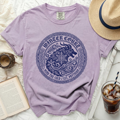 Purple t-shirt with a dark blue wolf and snowflake logo that says Winter Court