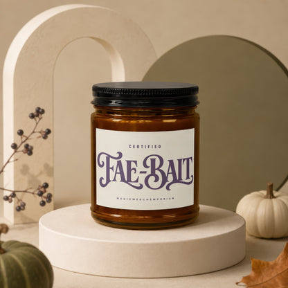Amber jar candle labeled "Fae-Bait" from Magic Merch Emporium.