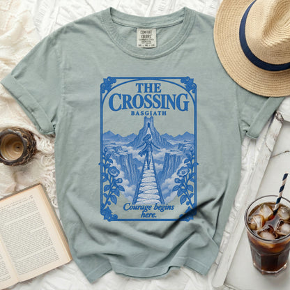 Light blue t-shirt with "The Crossing Basgiath Courage begins here" graphic.