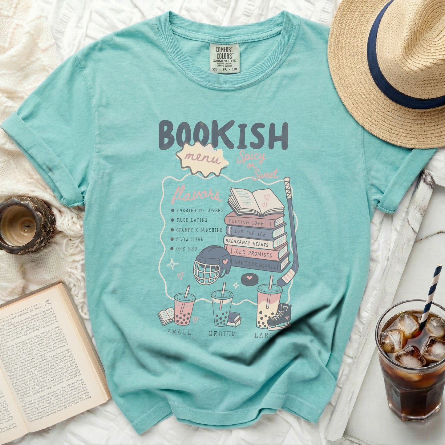 Light blue t-shirt with "Bookish Flavors" and book-themed icons.