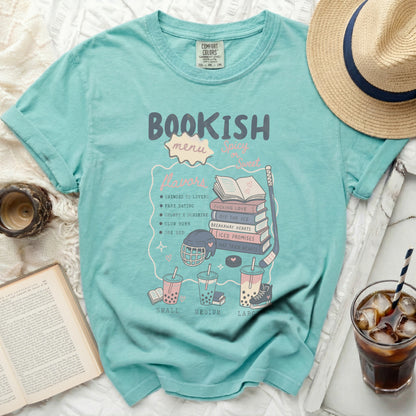 Light blue t-shirt with "Bookish Flavors" and book-themed icons.