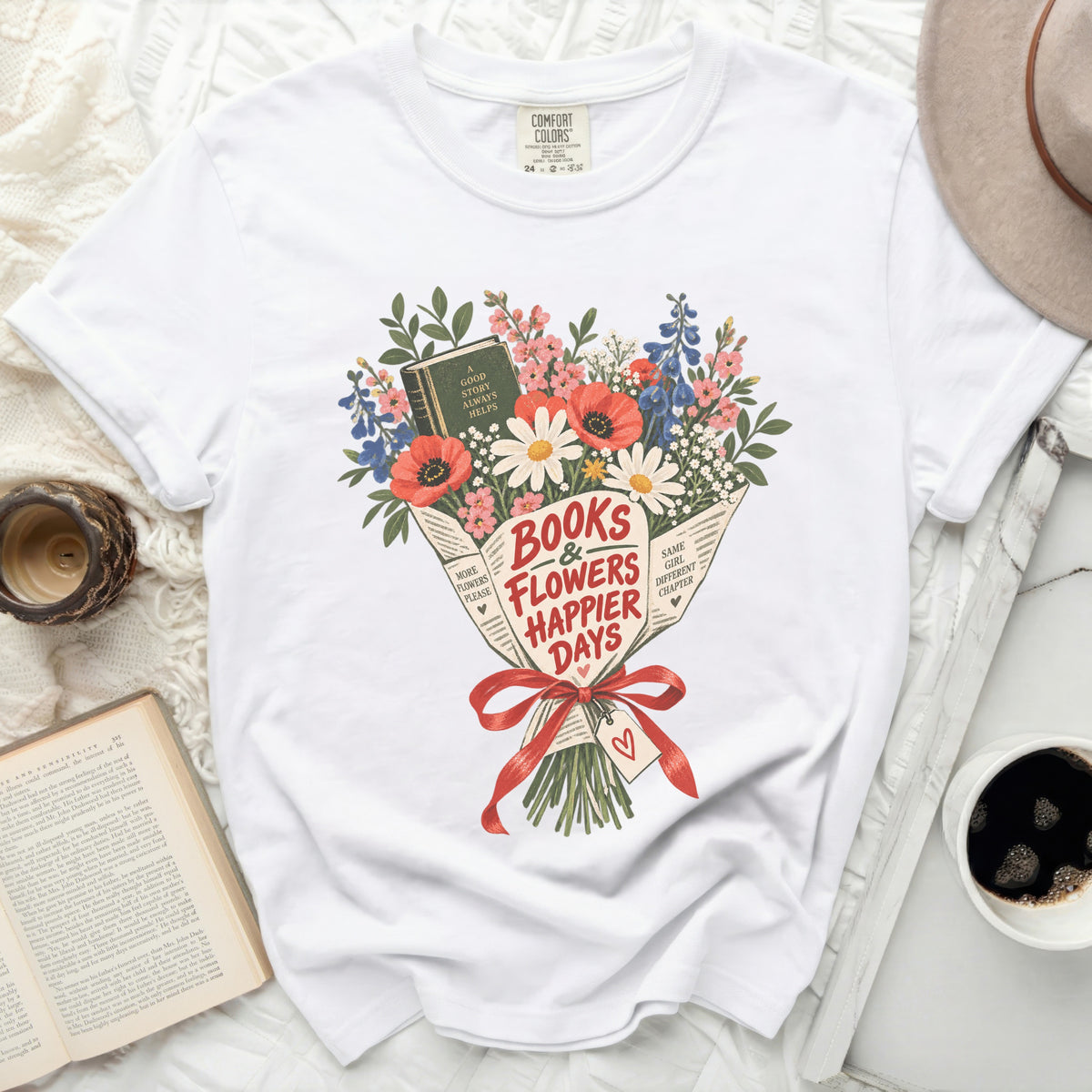 White t-shirt with "Books & Flowers Happier Days" floral bouquet graphic.