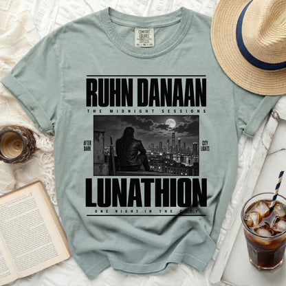 Light blue Comfort Colors t-shirt with "RUHN DANAAN LUNATHION" text and city skyline graphic.