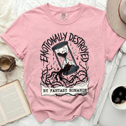 Pink t-shirt with "Emotionally Destroyed By Fantasy Romance" text and hourglass graphic.
