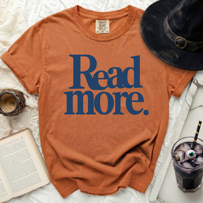 Orange t-shirt with "Read more." text in navy blue.