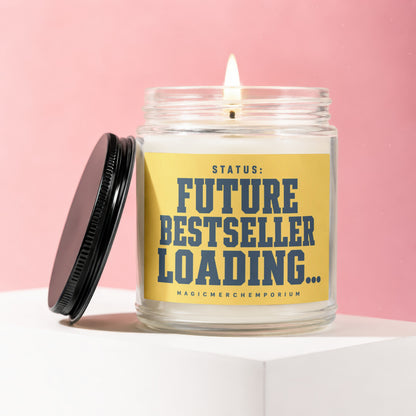Lit glass candle with yellow label that reads "STATUS: FUTURE BESTSELLER LOADING...".