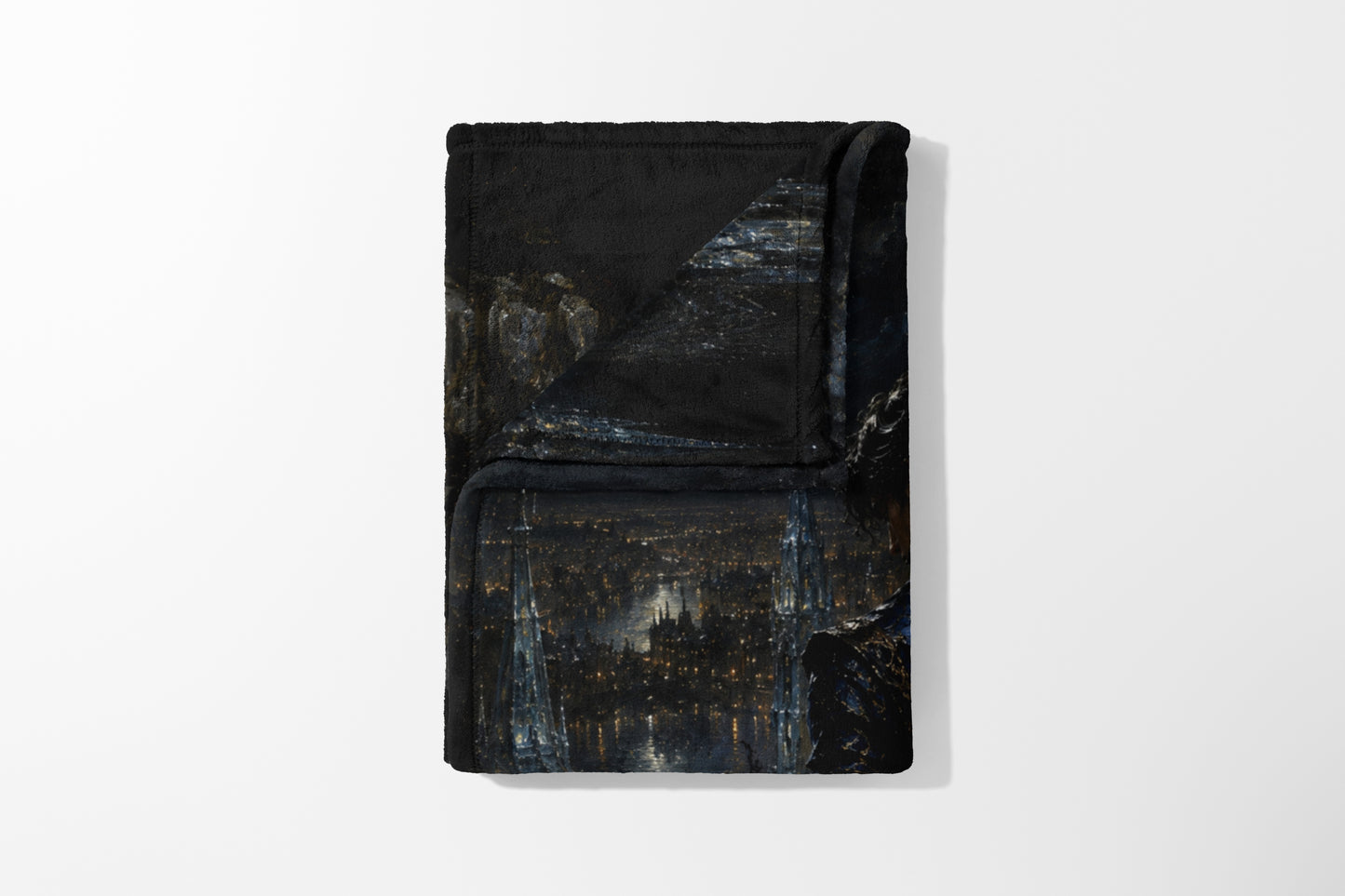 Folded black blanket with a dark cityscape and illuminated Eiffel Tower print.